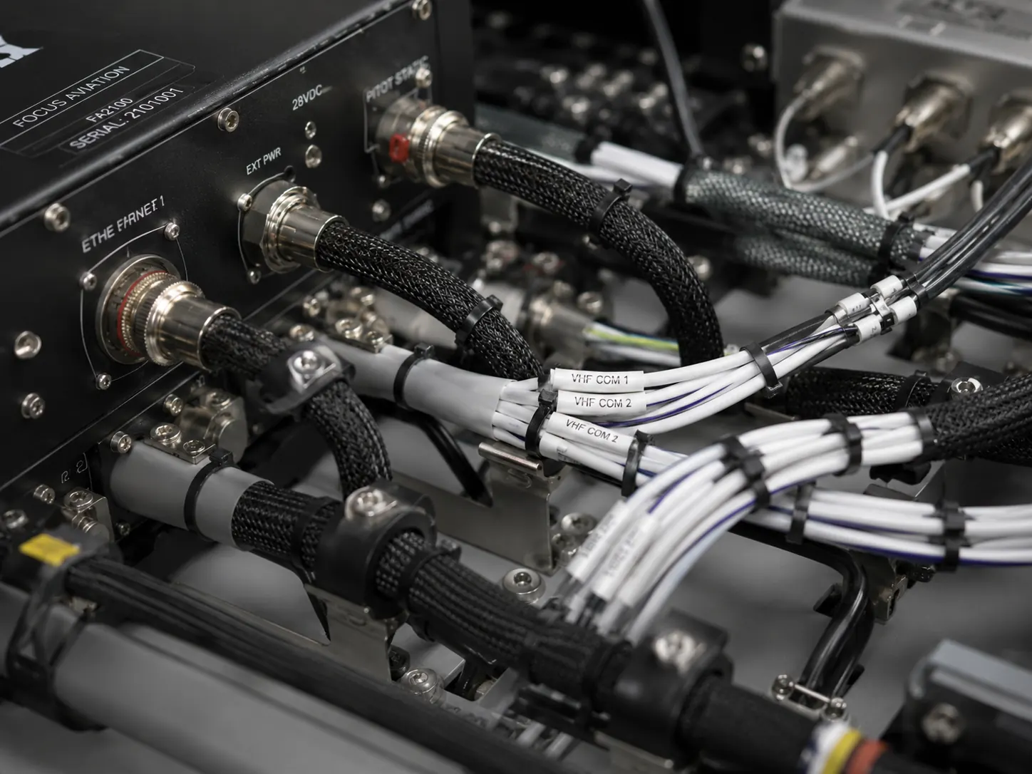 Close detail of aircraft avionics wiring, connectors and technical hardware